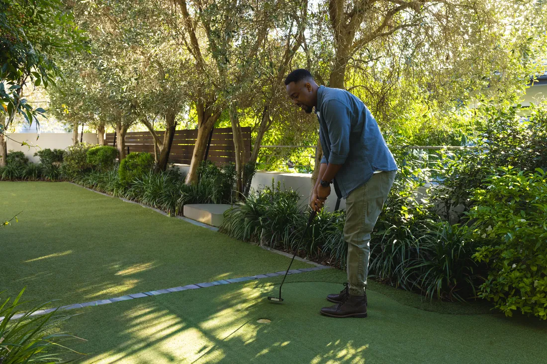 A backyard putting green built from short pile artificial turf